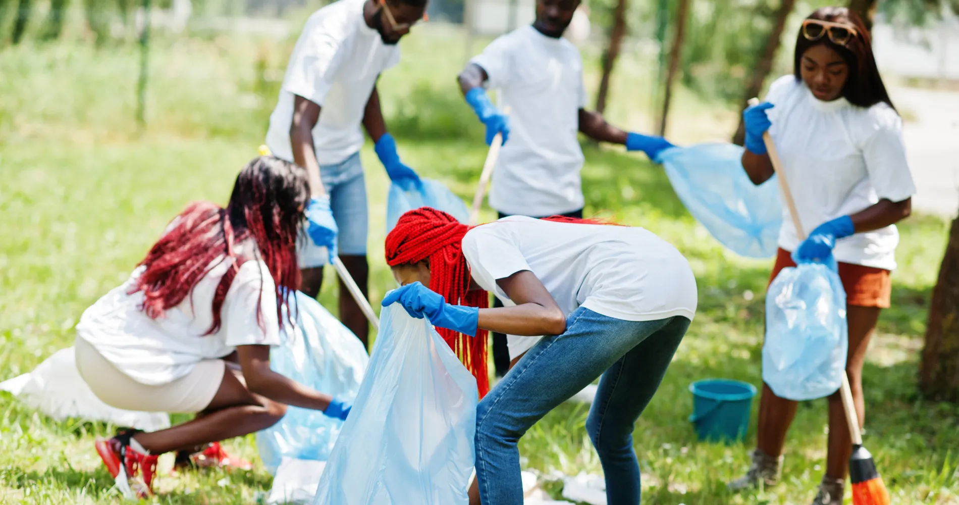 group-happy-african-volunteers-with-garbage-bags-cleaning-area-park-africa-volunteering-charity-people-ecology-concept (1) 1
