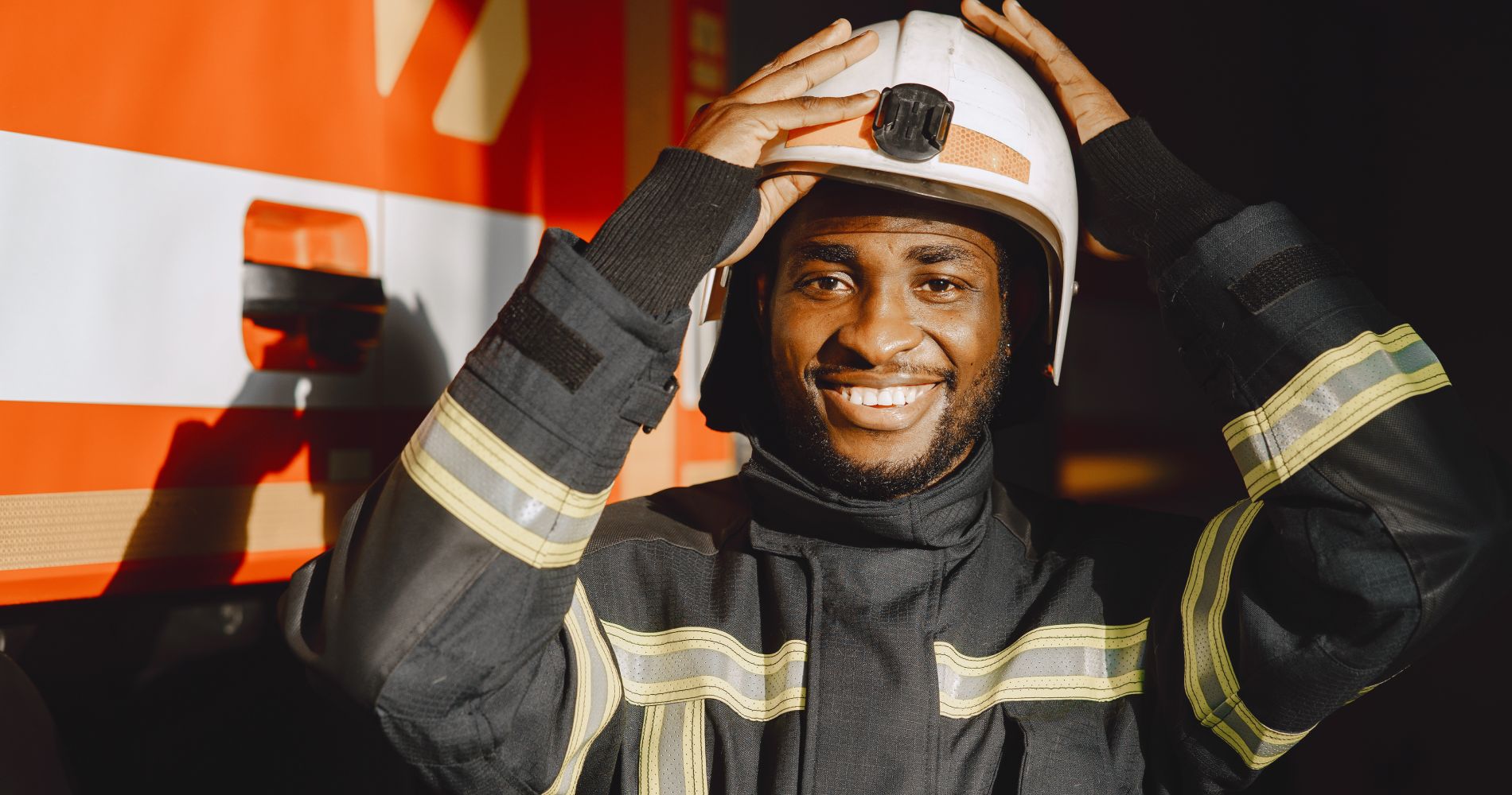 portrait-firefighter-standing-front-fire-engine 2 1