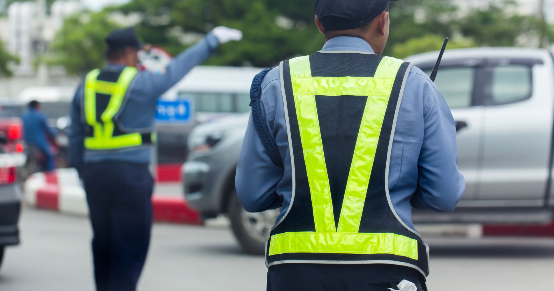 security-guard-acting-take-care-road-traffic-safe-driving 1