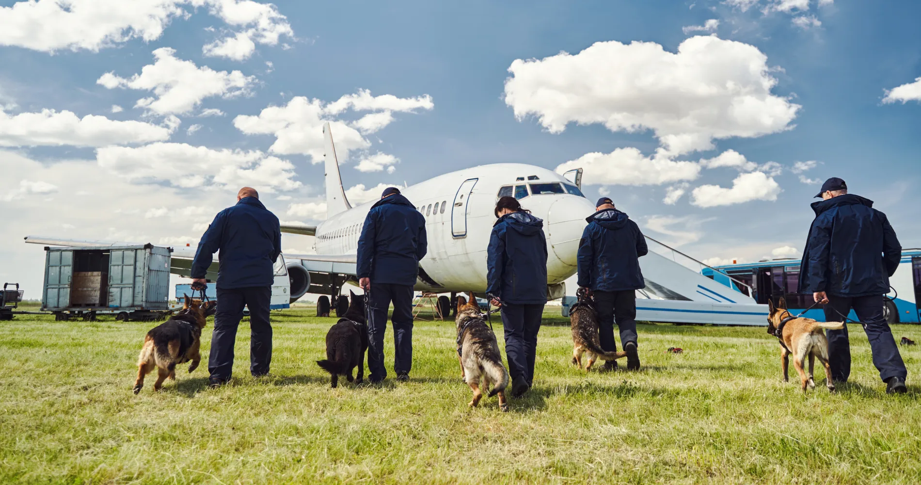 security-officers-with-detection-dogs-checking-ter-2026-03-10-02-10-49-utc 1